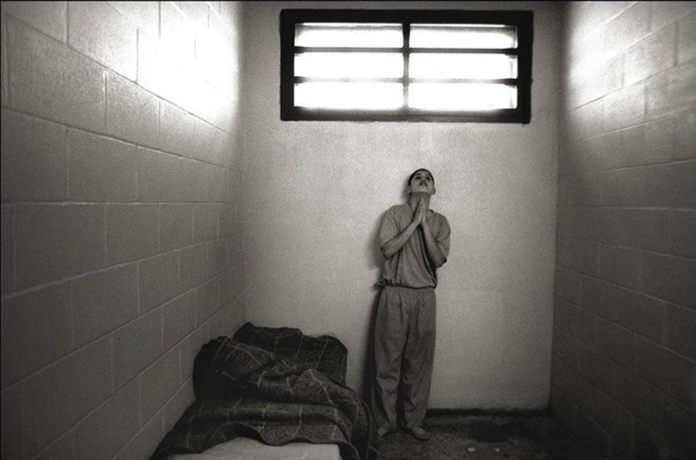Prisoner in Cell Praying