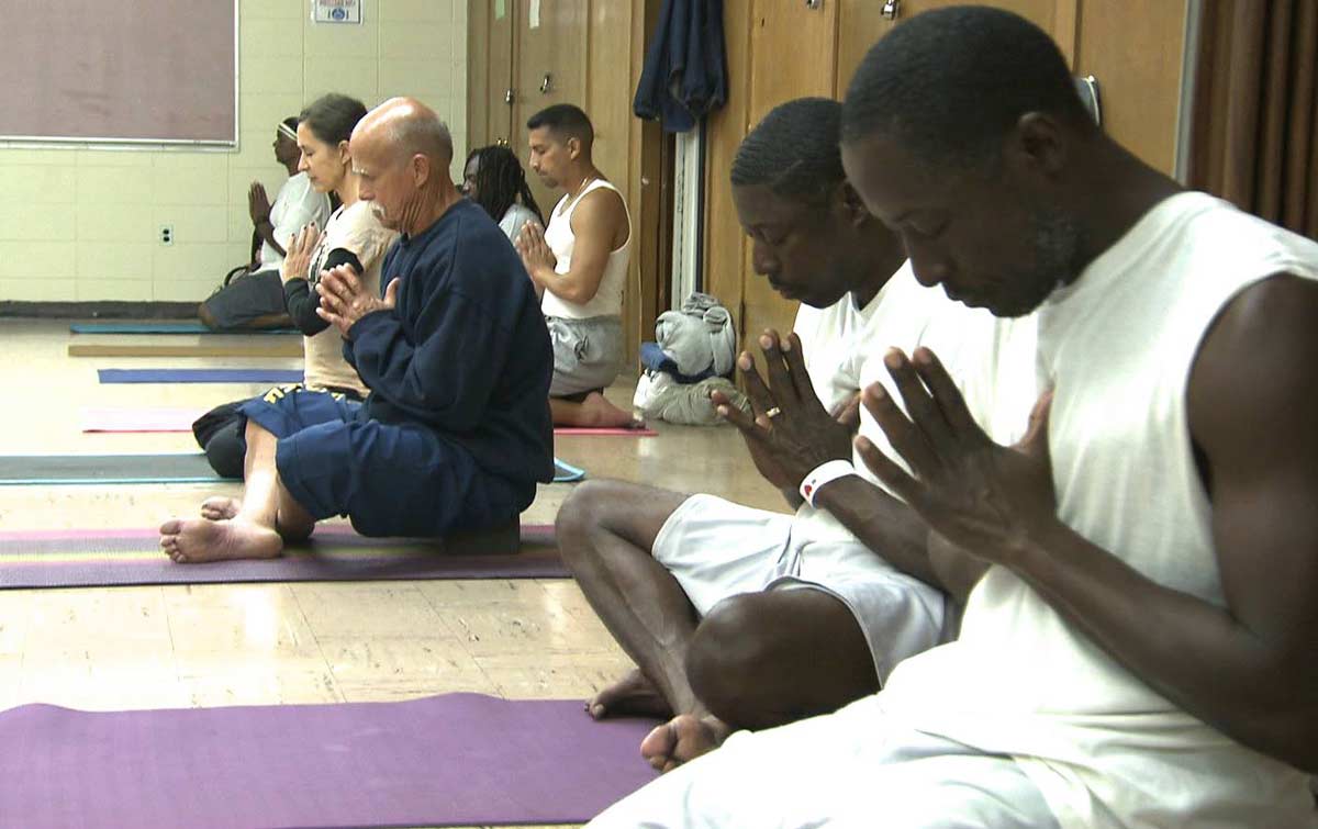 Group Pranam in Liberation Prison Yoga